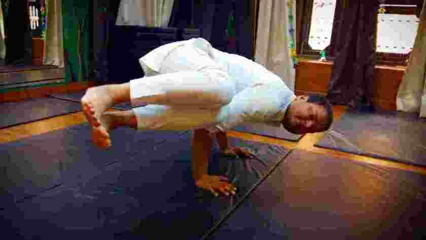 Premium Photo | Girl practices crow pose or crane pose on yoga mat and foam  bricks bakasana asana with yoga blocks home yoga
